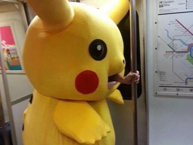 Massive Pikachu Holds On For Balance On The Subway