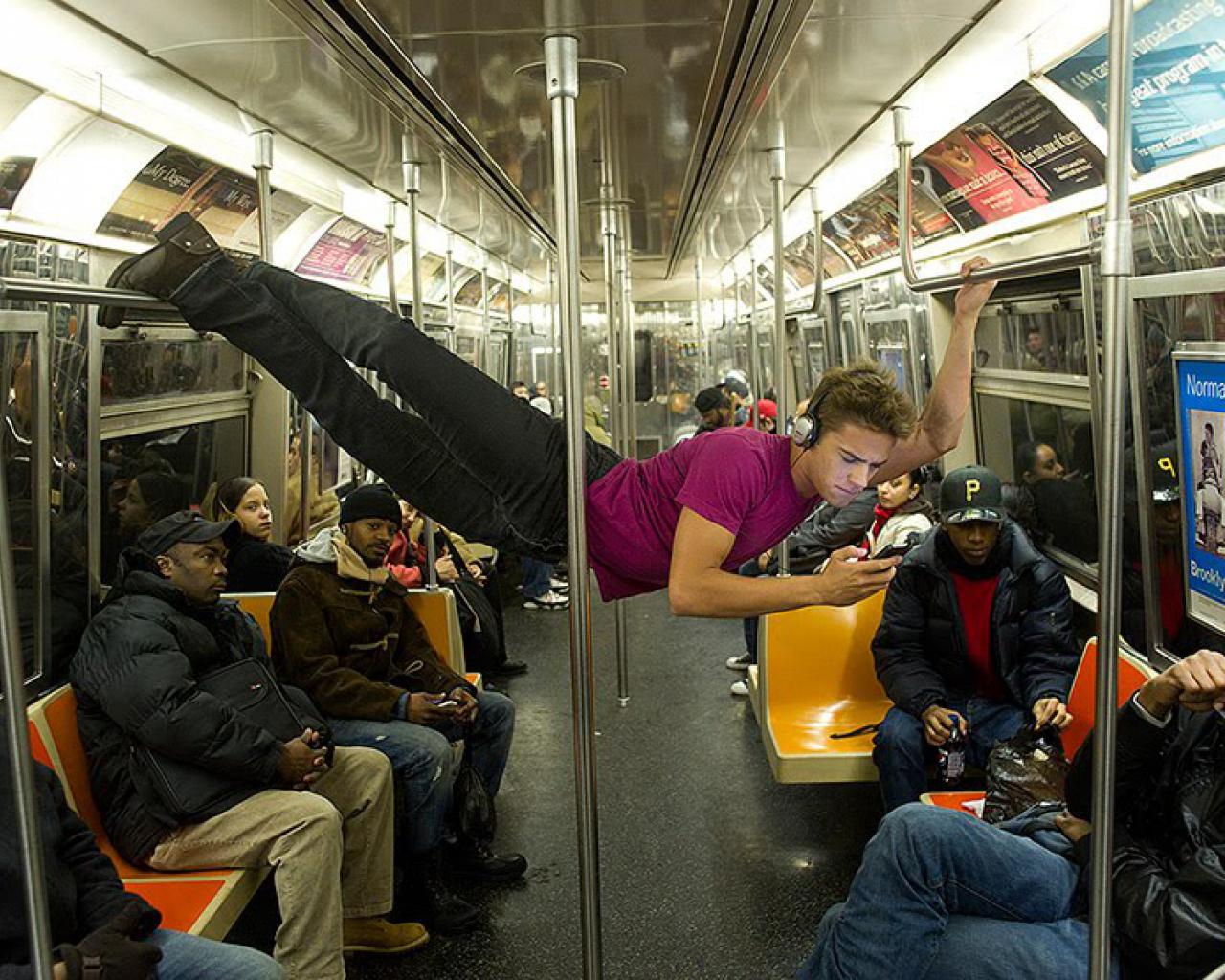 Acrobat Defies Gravity On The Subway