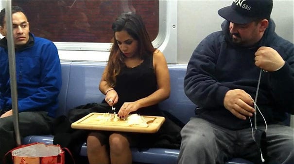 Woman Meal Preps While Other Commuters Look On