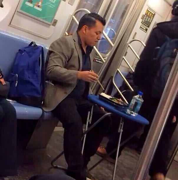 Man Enjoys A Classy Meal... On The Subway