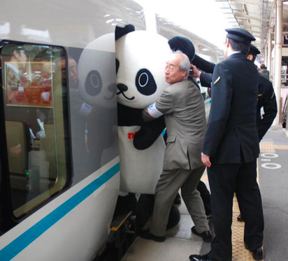 Working Together To Get A Panda On The Train