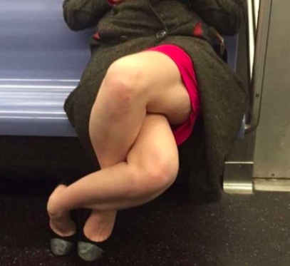 Woman Sits With Her Legs Crossed