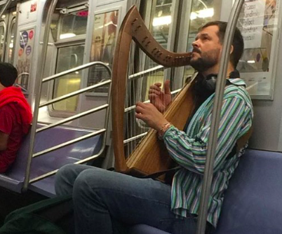 Man Plays Ballad For Fellow Commuters