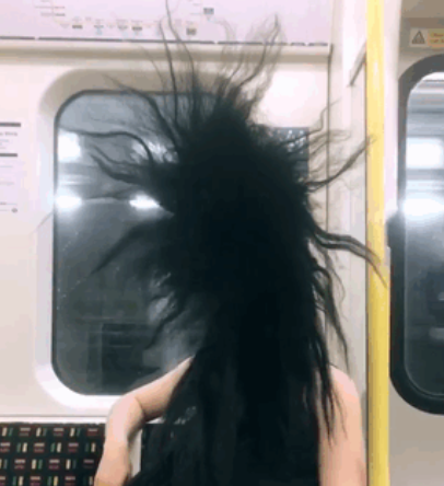 Hair Reaches To The Subway Ceiling